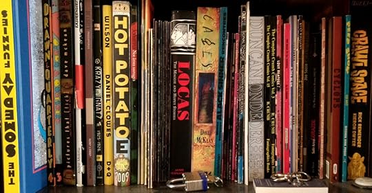 Some of the books on my shelves, mostly comics...
