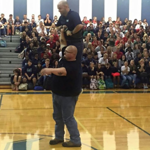 bud jeffries One arm pressing a teacher at a high school #antibullying assembly 