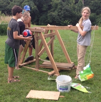 Homeschooled students building a trebuchet (click for credit)