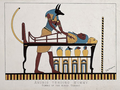 Anubis tending mummy in tomb