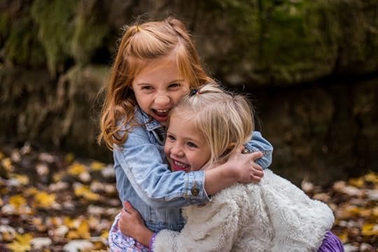 pexels-photo-225017-girls-hugging-fall-leaves