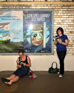 A completely unstaged photo of members of the public reading The Accidental Pirates on the London Underground. Any resemblance to me or my friend is coincidental.