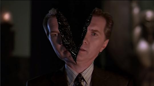 The Mayor's head is cleaved vertically in half from the top down to his neck.