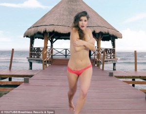 Girl loses her top on a pier