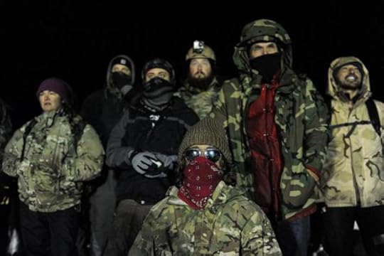Veterans have a demonstration on Backwater bridge during a protest against plans to pass the Dakota Access pipeline near the Standing Rock Indian Reservation, near Cannon Ball, North Dakota, U.S., December 1, 2016. REUTERS/Stephanie Keith
