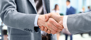 Handshake in front of business people