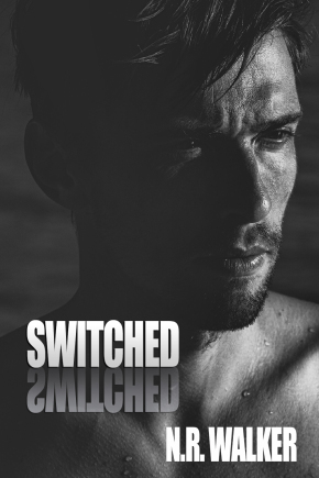 Dark moody portrait of an intense young man