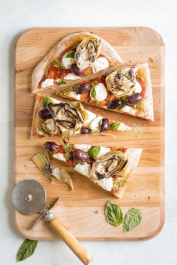 Grilled Artichoke, Olive and Pesto Flatbread Recipe - It's lighter than pizza (423 calories) and makes a better appetizer, too! Topped with kalamata olives, grilled artichokes, basil pesto, and mozzarella