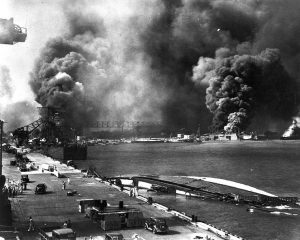 Pearl Harbor viewed from Pier 1010, 7 Dec 1941 after the attack (US National Archives)