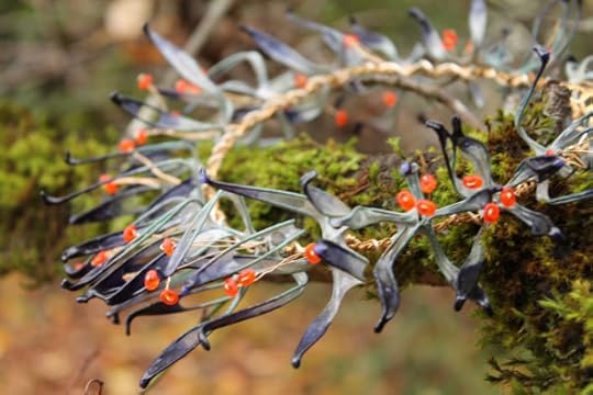 Indigo Lily Crown or Neckpiece: This is a one-of-a-kind piece that can be worn either as a crown or a neckpiece. The lilies are dyed with indigo dye and the pistils are made of brass and orange glass.