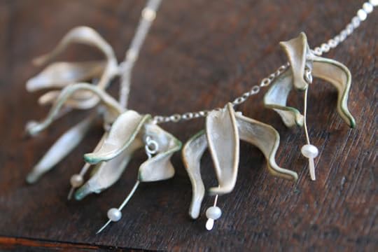 Lily Garland Necklace: Brass and abaca flowers with sterling silver and freshwater pearl drops, on a sterling silver chain.