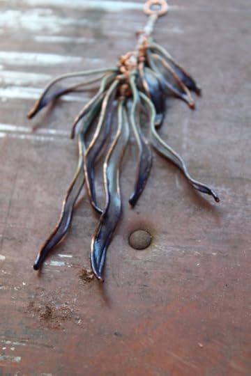 Indigo Petal Cascade Necklace: Brass and abaca paper indigo petals, ombre dyed, on a sterling silver chain. 