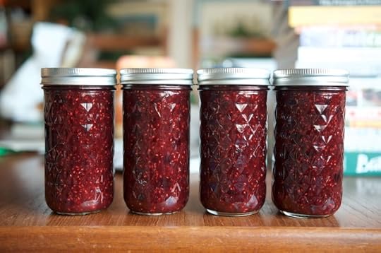 Four jars of holiday berry jam.