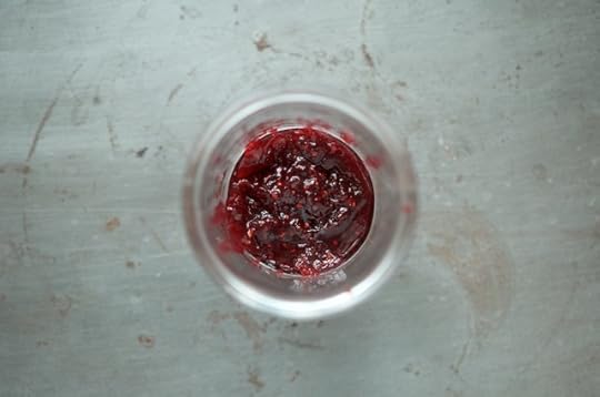Holiday berry jam in an open jar.