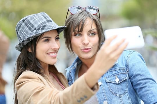 40644230 - girlfriends taking selfie picture with smartphone