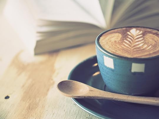 35377791 - cup of coffee latte art with book in coffee shop vintage color