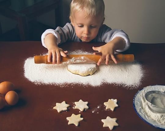 little boy decorating christmas cookies: 