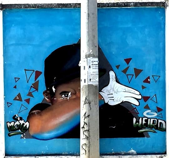 Street Art beind pole