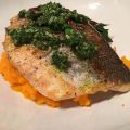 Seabass with carrot-top pesto on beet greens and carrot pur��e.