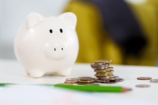 40180751 - pile of different coins near white piggybank on table closeup. budgeting expenses concept. making savings and effective investment concept