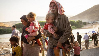 OlderMan WomanCarryRefugeeChildren