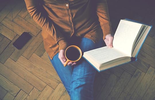 46577351 - girl reading book and drinking fresh coffee