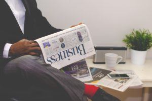 man-reading-business-newspaper