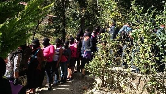 Zapatista women arrive at an information session.