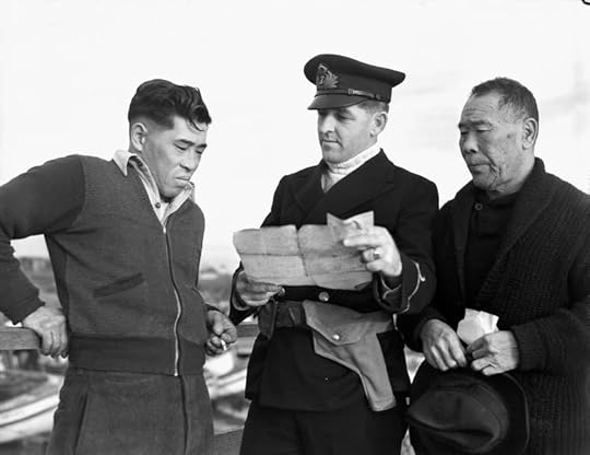 Royal Canadian Navy officer questioning Japanese-Canadian fishermen while confiscating their boat, 9 Dec 1941 (Library & Archives Canada: DAPDCAP 556450)