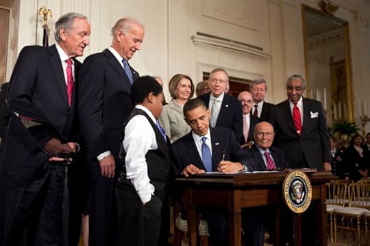 Obama signs health care By Pete Souza Via wikimedia commons