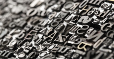Letterpress background, close up of many old, random metal letters with copy space