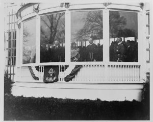 Herbert Hoover, Mrs. Hoover and William Howard Taft watch the inaugural parade on March 4, 1929, National Photo Company Collection, Prints and Photographs Division.