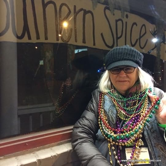 blogger Carole Terwilliger Meyers with Mardi Gras beads at Southern Spice restaurant in Lake Charles, LA