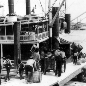 Rousties loading a riverboat