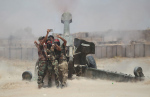 Shi'ite fighters take a selfie while firing artillery towards Islamic State militants near Falluja, Iraq, May 29, 2016. REUTERS/Alaa Al-Marjani TPX IMAGES OF THE DAY - RTX2EPWT