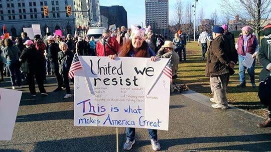 Image may contain: 1 person, standing, crowd, tree and outdoor