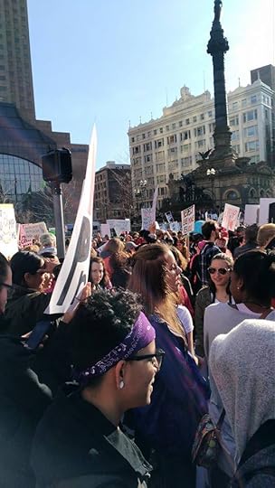 Image may contain: 3 people, people smiling, crowd, sky and outdoor