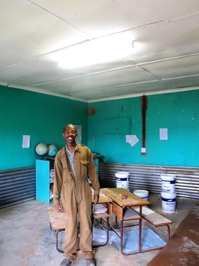 The electrician who has installed lights in the staff room at school.