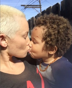 single mom shares a kiss with her son