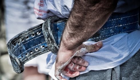 Man wearing a weight belt.