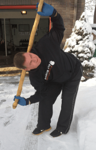 dan john doing a Windmill Stick stretch