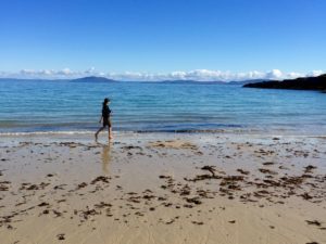 Anne walking on the beach of Colonsay, one of the islands that appears in the novel.