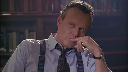 Giles, touching his mouth while he's thinking.