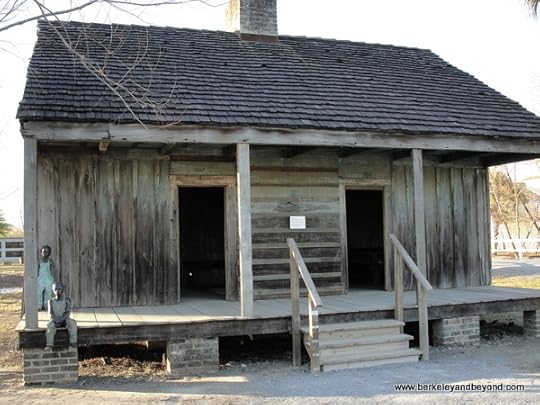 slave cabin with child sculptures at Whitney Plantation in Wallace, Louisiana