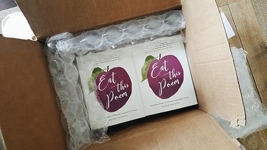 A box of books filled with copies of Eat This Poem