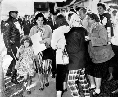 White people harassing white woman for taking her child to her own school that was recently integrated. They wanted her to refuse to send her child to school with black people.