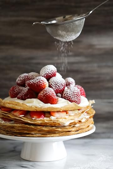 Crepes aren't just for rolling, something special happens with you layer then with cream and top them with strawberries. It creates a beautiful cake-like dessert, when you slice into it, you can see all the layers.