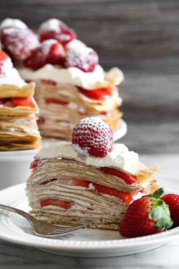 Crepes aren't just for rolling, something special happens with you layer then with cream and top them with strawberries. It creates a beautiful cake-like dessert, when you slice into it, you can see all the layers.