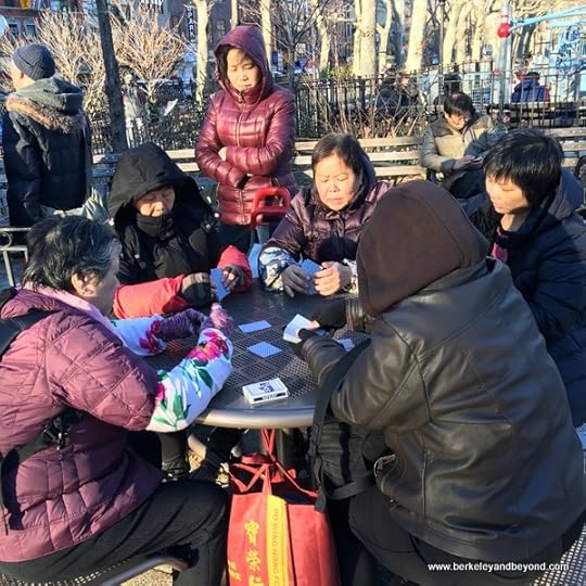 adults playing game outside Hester Street Playground in NYC