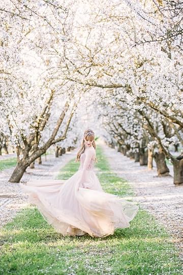woman amid beautiful blossoms: 